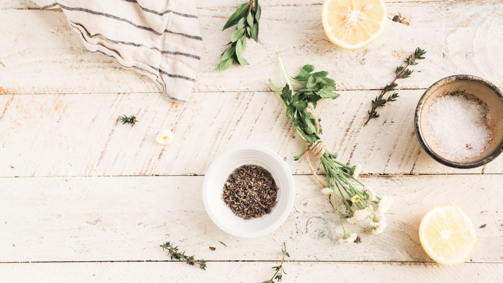 Background of Table with Herbs, Salt, & Lemon Slices